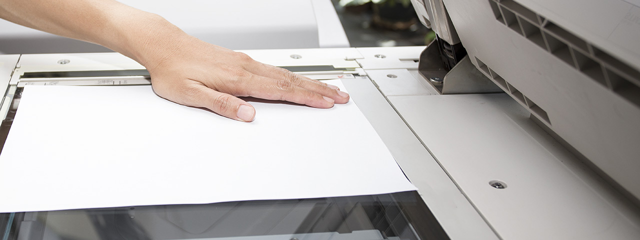 woman's hand scanning a document